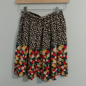 Pleated silk skirt by Corey Lynn Calter